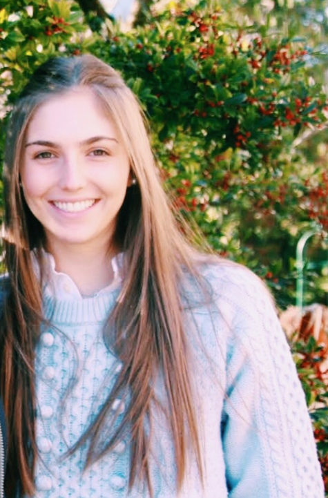 Young white woman with long hair smiling