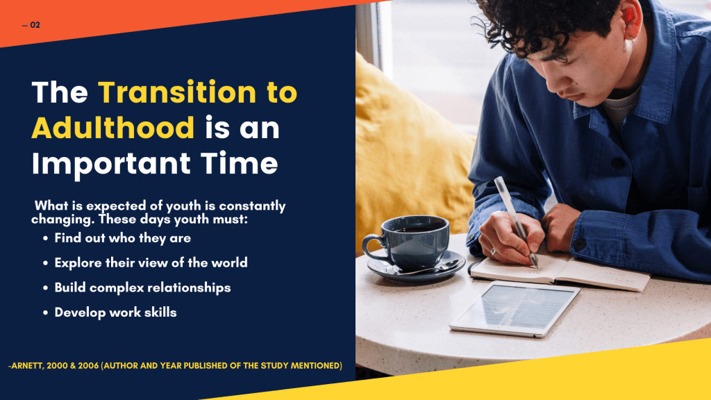 A young man wearing a blue shirt and writing on a notebook. He is sitting and on the the table in front of him there is tea cup and a tablet.